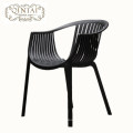 Wholesale good quality woven style hollow reading chair plastic orange leisure PP furniture with arm